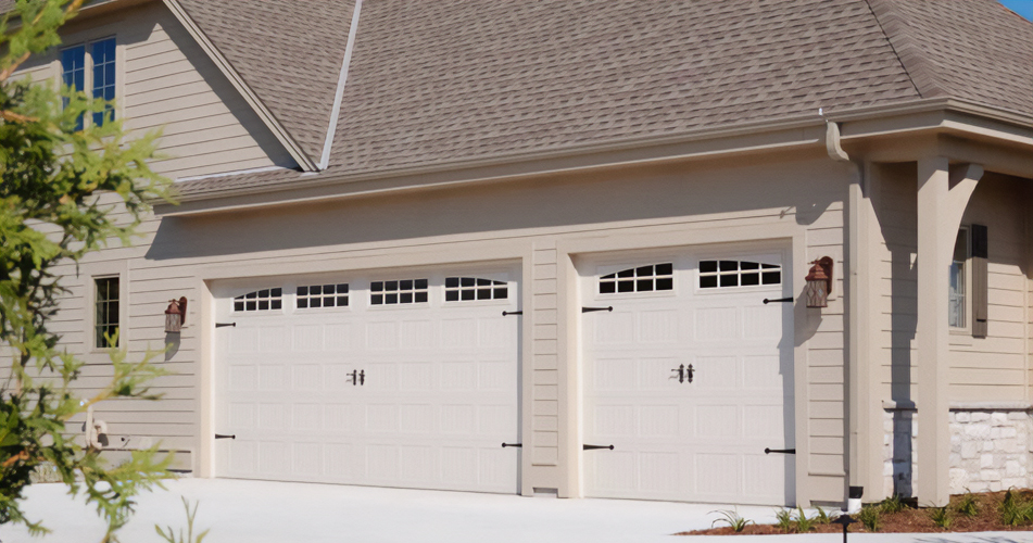 Stamped Carriage House Garage Doors by Matrix Exteriors